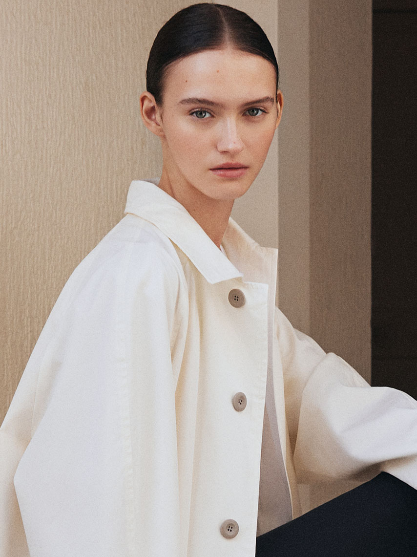 A portrait of a model wearing an off-white overshirt.